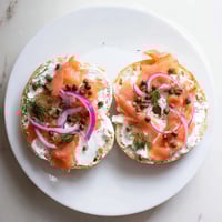 Toasted Bagel with Cream Cheese and fresh dill, a creamy classic American breakfast ready to enjoy.